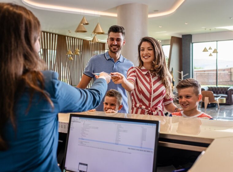 Family is checking into hotel, ready for their personalized hospitality experience